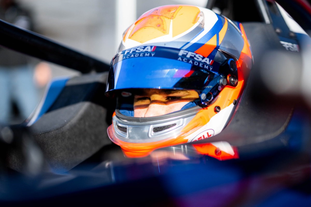 Close-up of Jack Iliffe in helmet with visor up